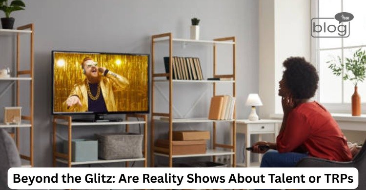 A woman watches a singer in a gold jacket performing on a TV show. The room is cozy with shelves and a plant. Text reads, "Beyond the Glitz: Are Reality Shows About Talent or TRPs?"
